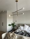 Interior of bedroom with unmade bed in morning