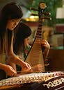 Women Playing String Instruments