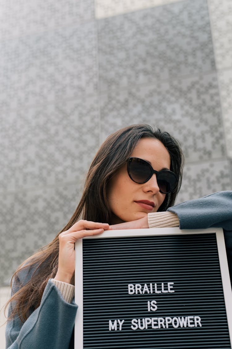 Woman Leaning On A Letter Board