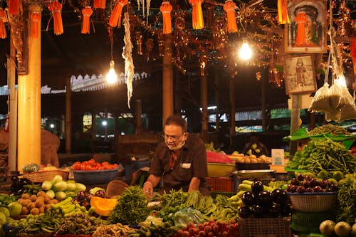 Man Selling Vegetables on Bazaar