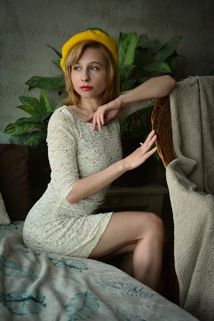 Attractive Woman In Vintage Dress In Bedroom