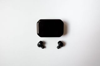 Wireless earbuds with their charging case