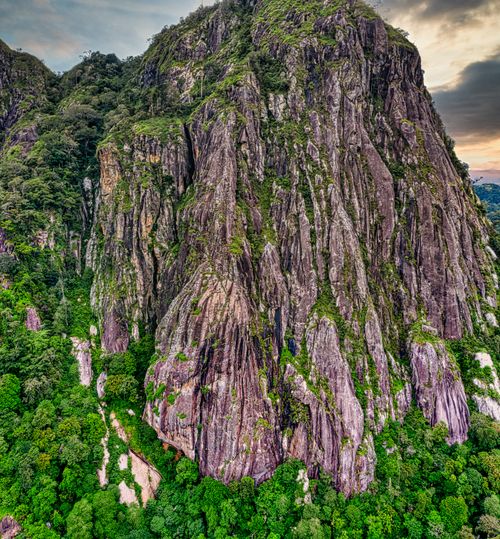 Free Explore the dramatic rock formations and lush greenery of Purwakarta, Indonesia, captured in a stunning high-angle shot. Stock Photo