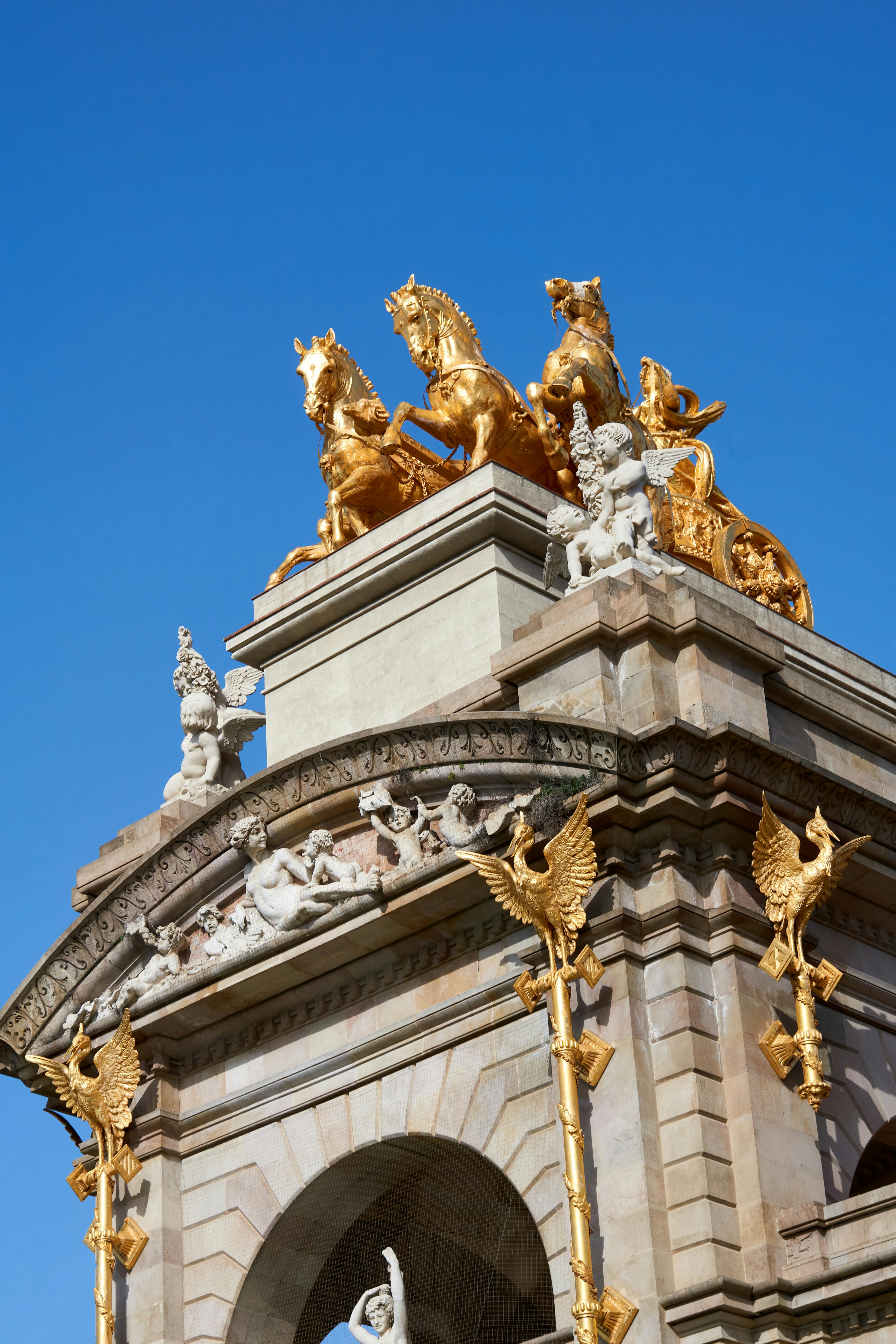 golden horse statues on top of a building