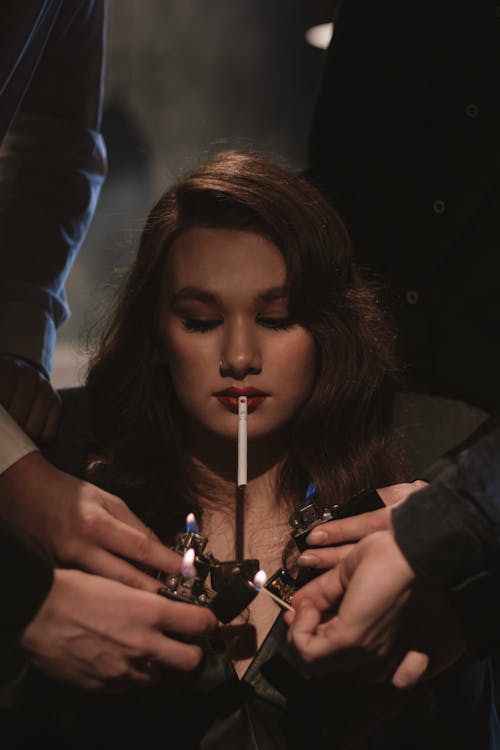 beautiful women lighting cigarettes