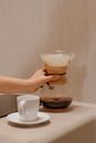 Person Holding a Glass Coffee Dripper