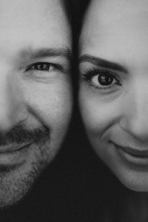 Grayscale Photo of a Couple's Faces