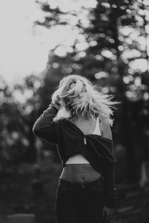 Grayscale Photo of a Woman Shaking Her Head