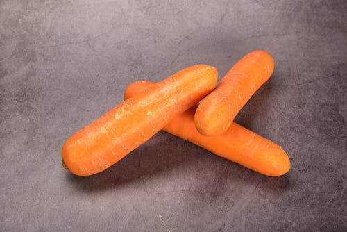 Orange Carrots on Gray Concrete Surface