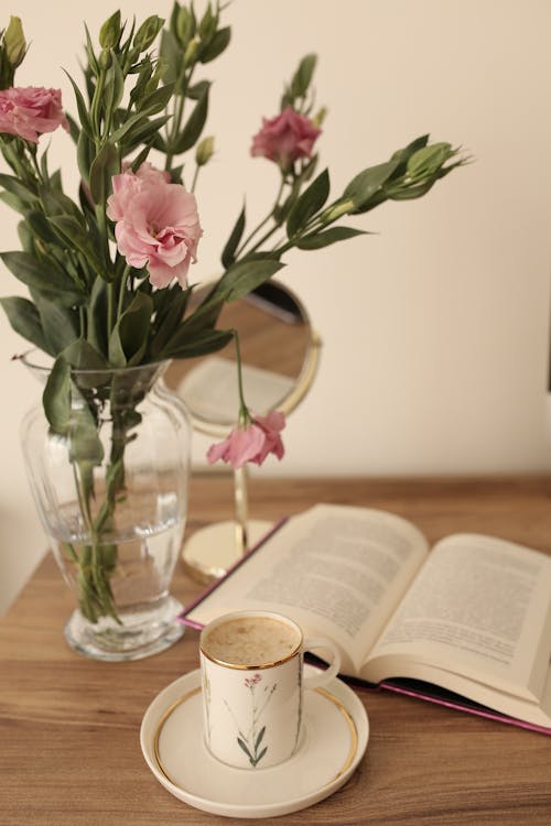 Pink Roses in Clear Glass Vase on Brown Wooden Table