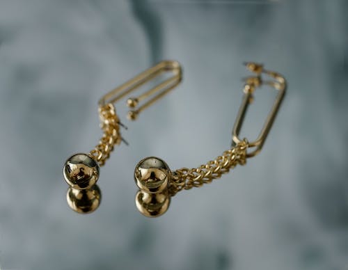 Close-Up Shot of Gold Earrings