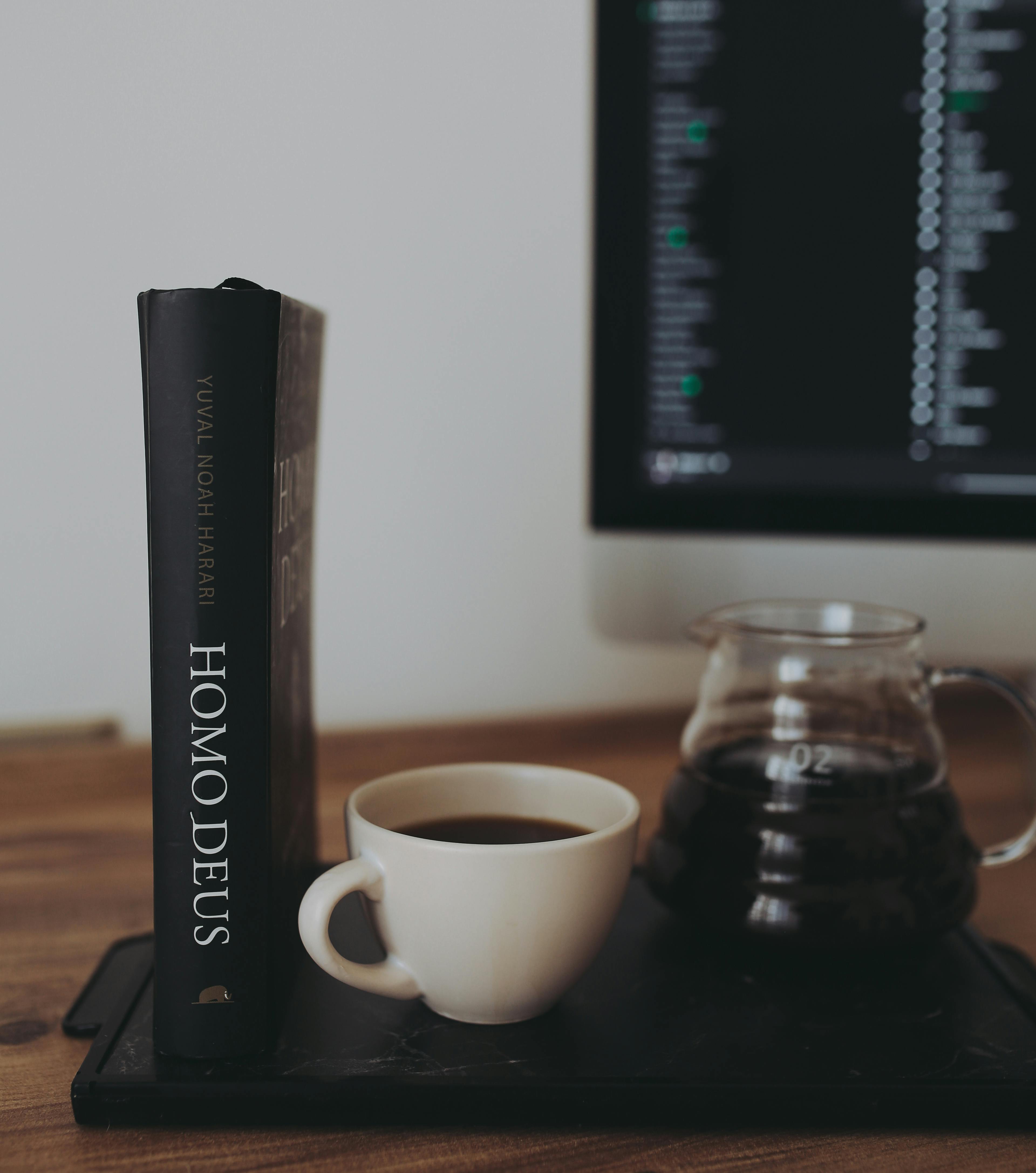 coffee with book near computer