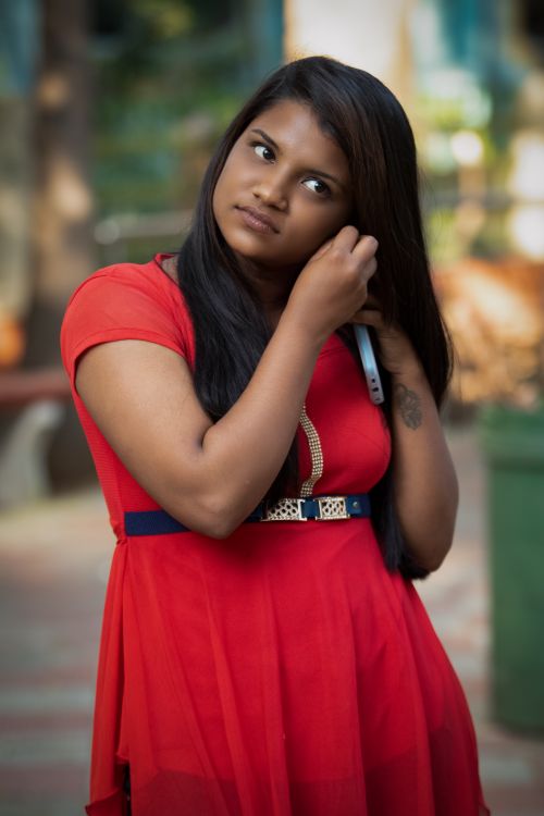 A Woman in Red Dress Standing · Free Stock Photo