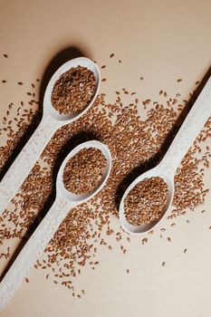 A Flax Seeds on a Wooden Spoons
