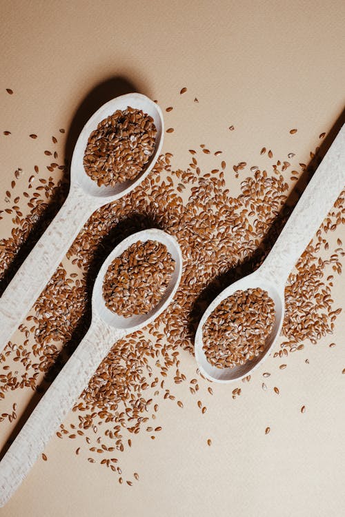A Flax Seeds on a Wooden Spoons