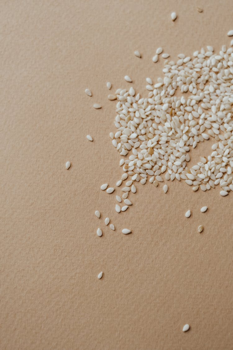 A Sesame Seeds On A Flat Surface