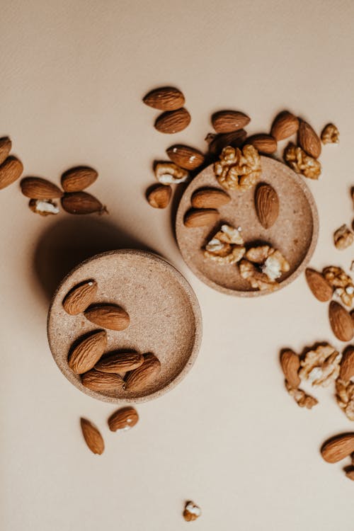 Free Overhead Shot of Brown Walnuts and Almonds Stock Photo