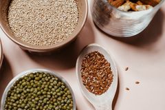 A flat lay of various nuts and seeds, showcasing natural and organic ingredients for healthy cooking.