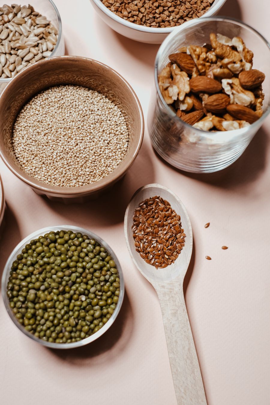 A selection of dry seeds and pulses in bowls