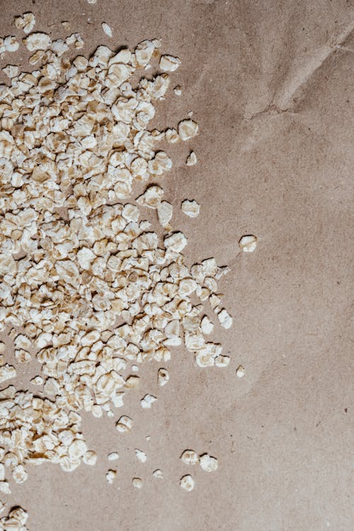 Oatmeals Scattered on Brown Paper