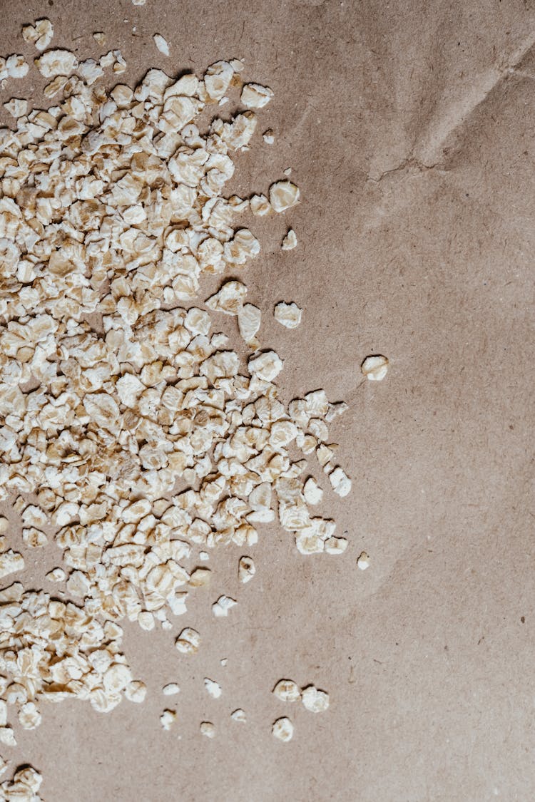 Oatmeals Scattered On Brown Paper