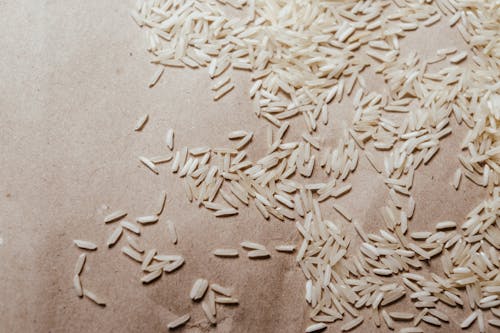 White Rice Grains on Brown Textile