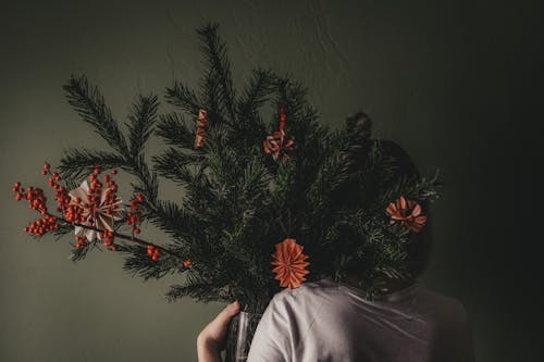 Unrecognizable person with winter bouquet