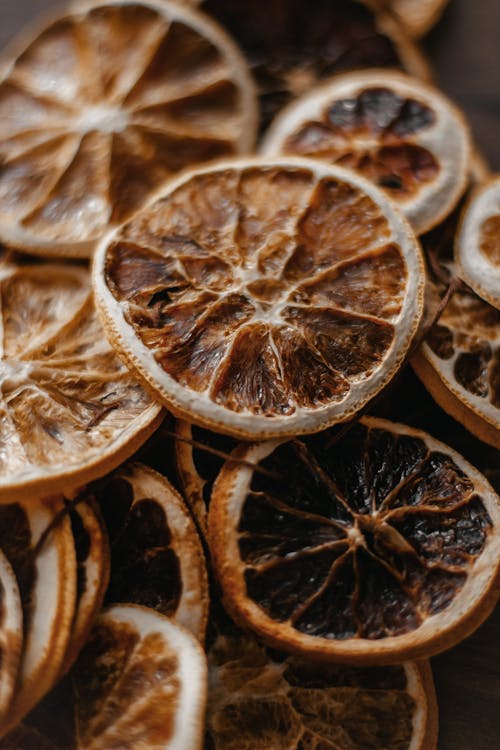 Free Sliced dried oranges heaped on table Stock Photo