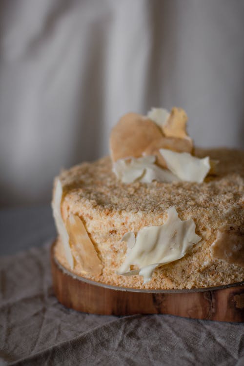 Yummy vanilla cake on table in bakery studio