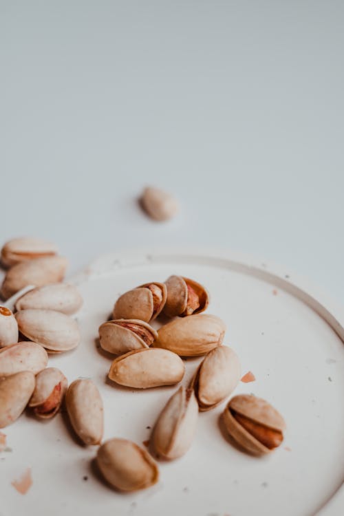 Free Pistachio Nuts on a Saucer Stock Photo