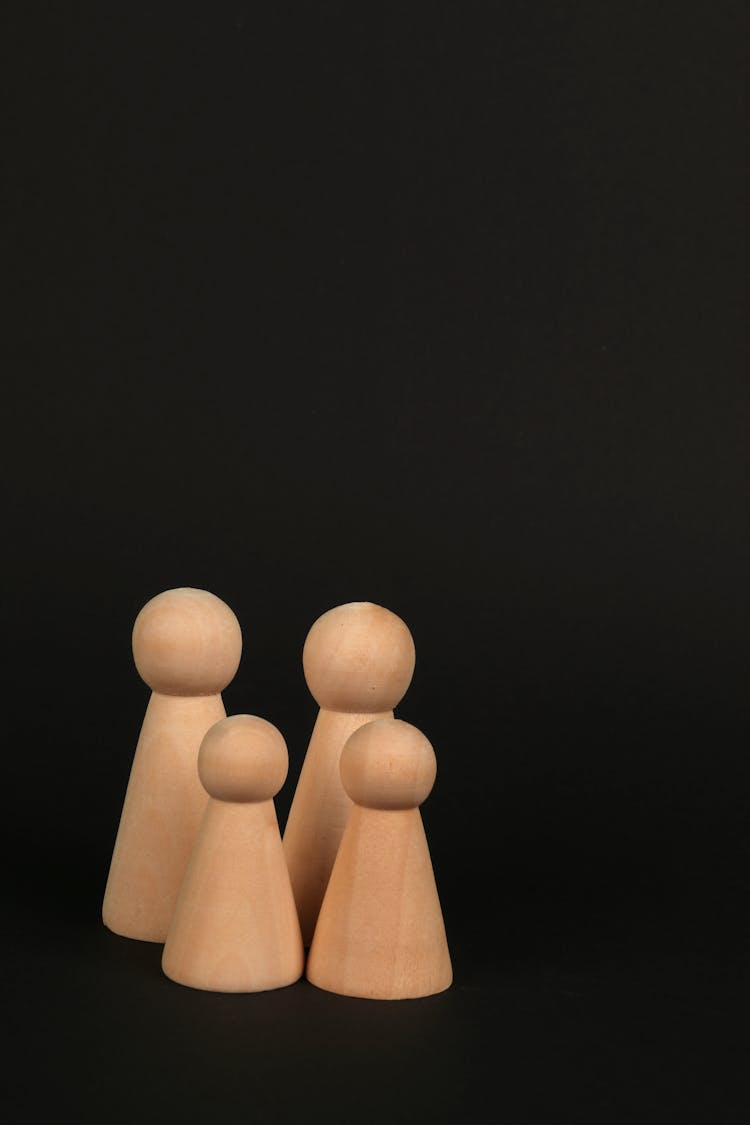 Wooden Figures On Black Background