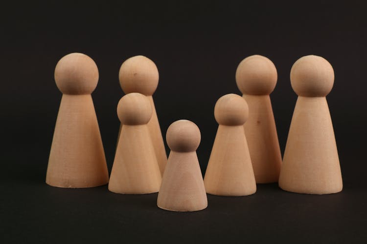 Wooden Figures On Black Background