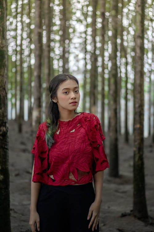 Selective Focus Photo of a Beautiful Woman in the Woods 