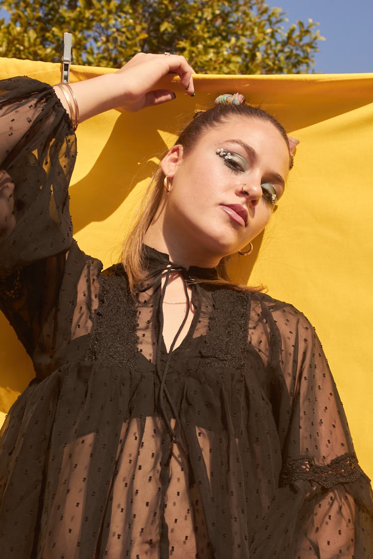 A Low Angle Shot Of A Woman In Black See Through Dress