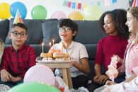 Kids Looking at the Birthday Celebrant while Making a Wish