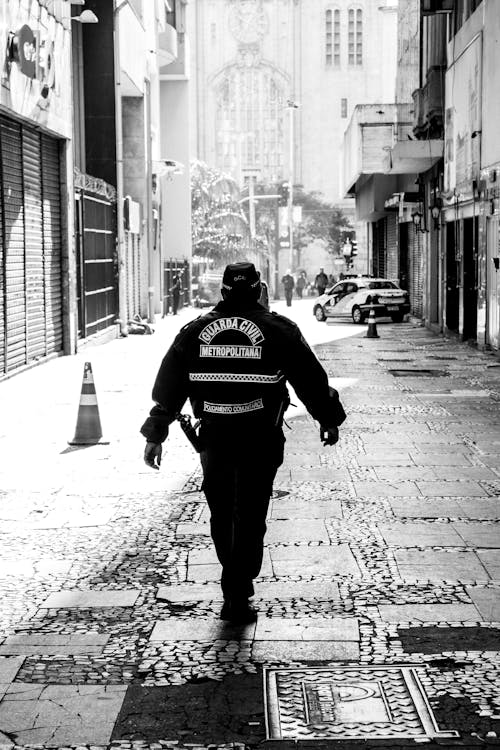 Free Civil Guard Walking on the Street Stock Photo
