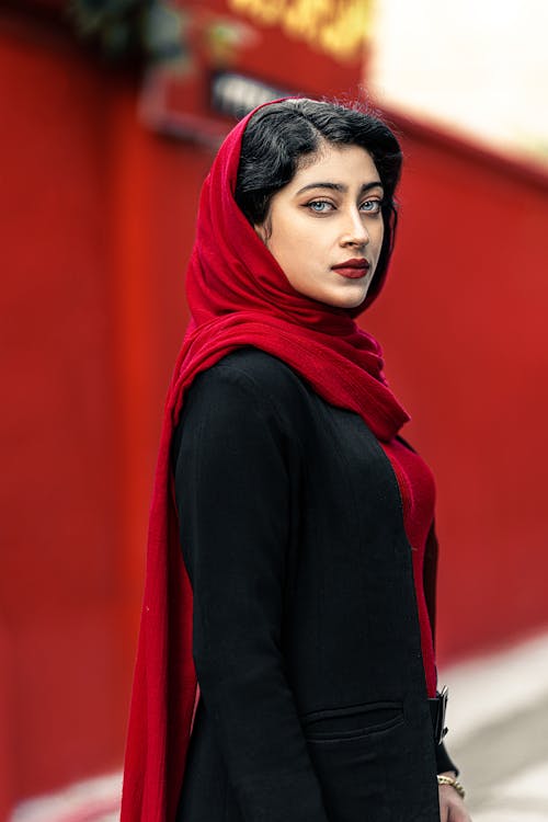 Portrait of a Beautiful Woman with Black Hair Wearing a Red Headscarf 