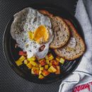 Egg and Bread on Black Round Plate