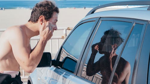 Free A man Looking at the Car Window Stock Photo