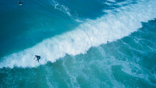 Man Surfing on Sea Waves