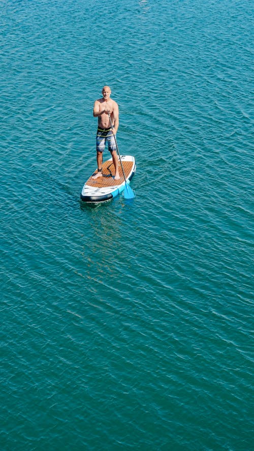 Free A Man on a Paddleboard Stock Photo