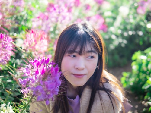 A Beautiful Woman in a Garden Full of Flowers