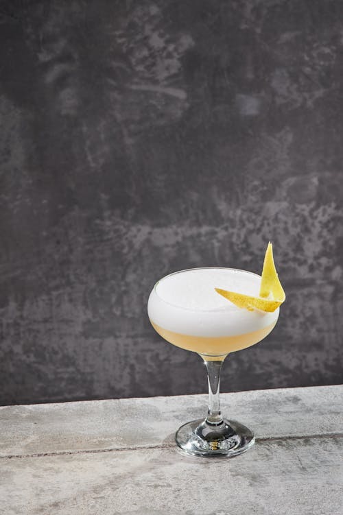 Free Photo of a Cocktail Drink on a Cement Surface Stock Photo