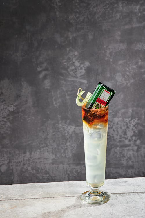 A Cocktail Drink with Glass Bottle on Top