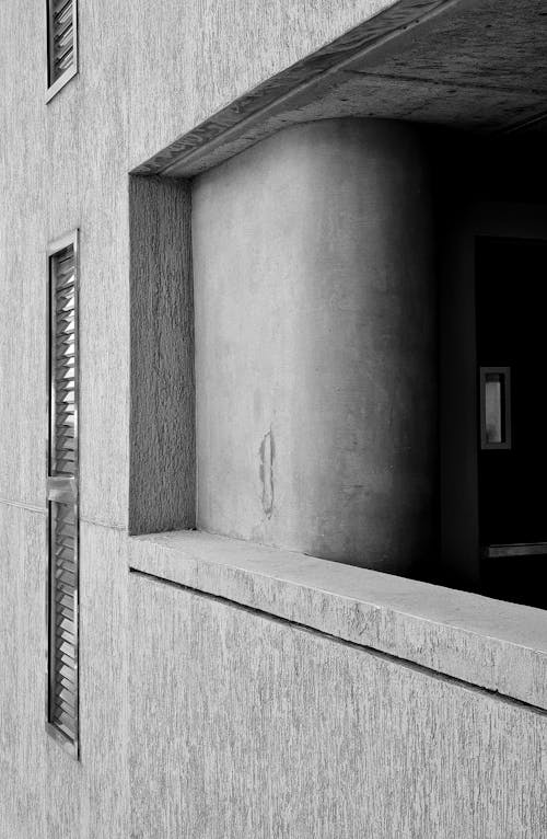 A Concrete Wall of a Building in Black and White