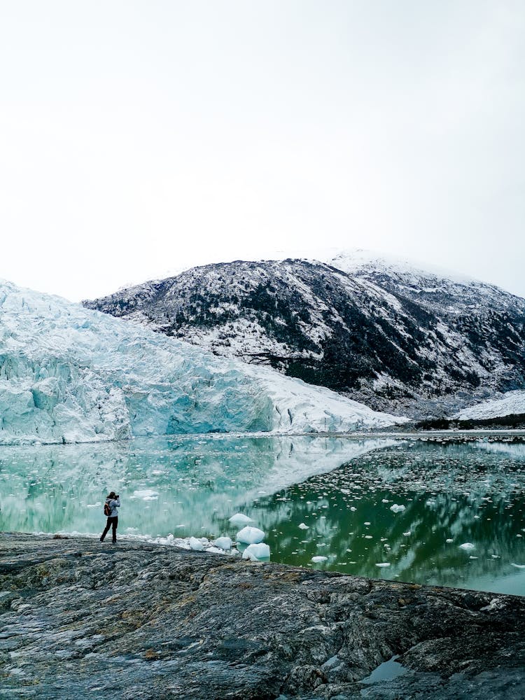 An Adventurer Looking At The Pia Glacier