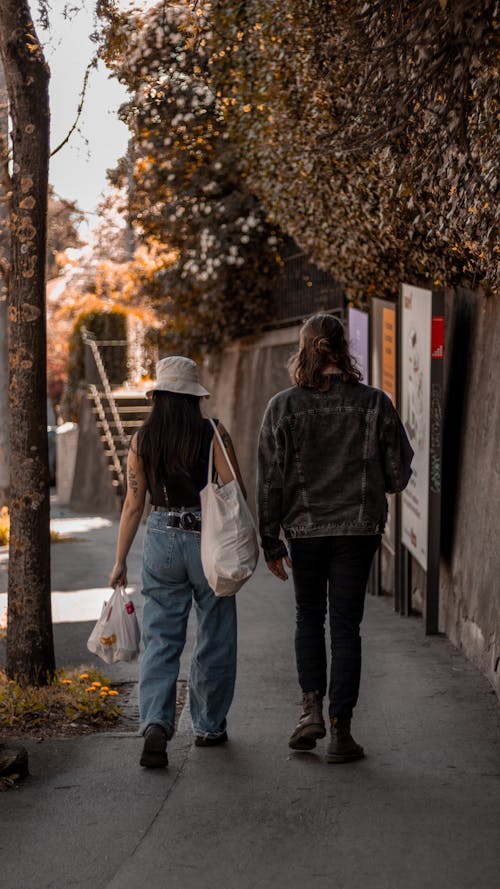 Free People Walking on the Sidewalk Stock Photo