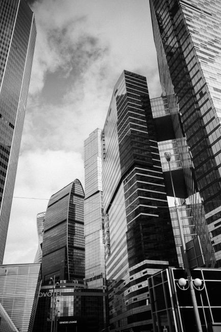 High-rise buildings capture urban elegance in this black and white cityscape.