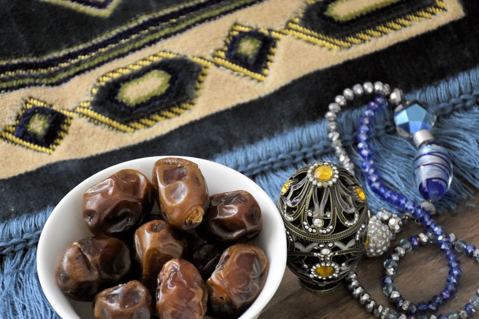 Small cups of Saudi Gahwa (cardamom coffee) served with dates, symbolizing hospitality in Saudi Arabia.