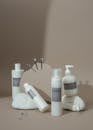 White Plastic Bottles on White Table